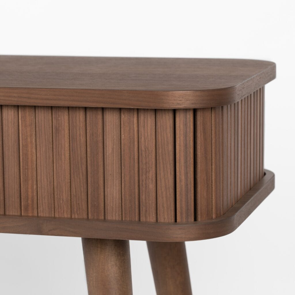 Detalj av konsolbord Barbier i valnöt med ribbad front och rundade hörn