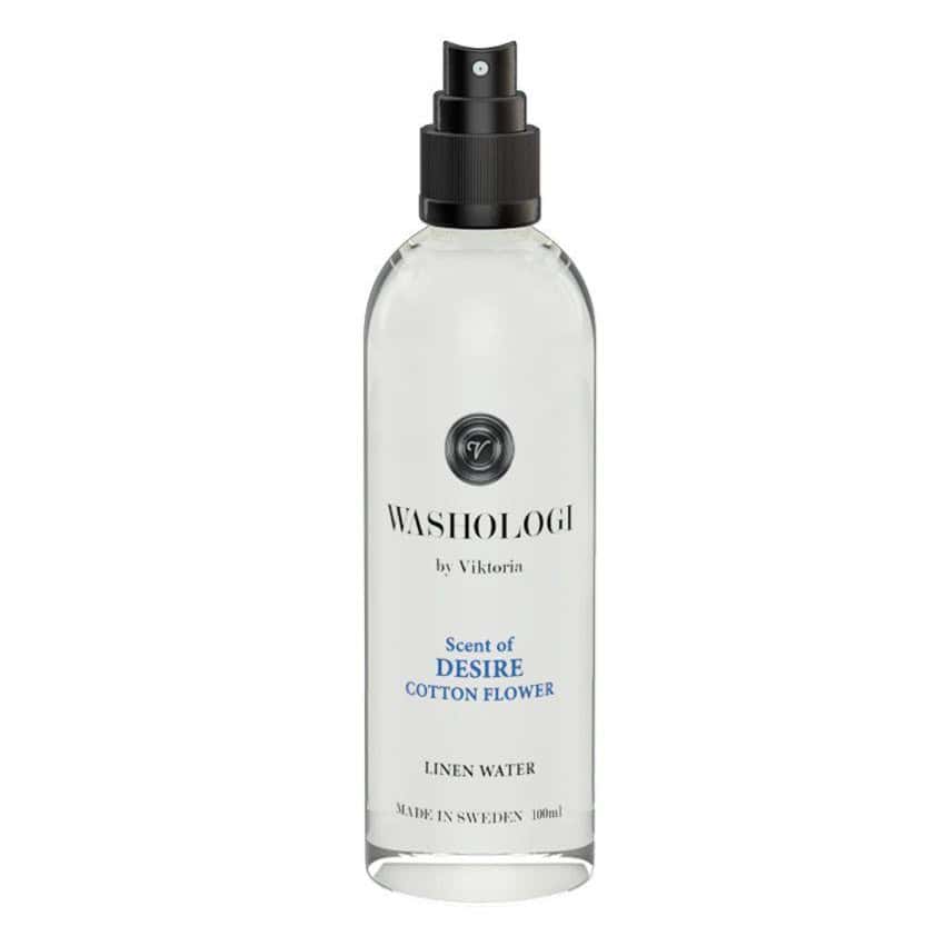Flaska med linnevatten Desire från WASHOLOGI, 100 ml, med en mjuk doft av bomullsblomma.