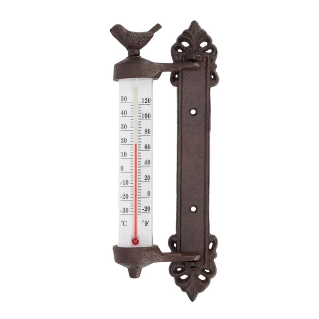 Väggtermometer i gjutjärn från Esschert Design med en liten fågel som dekoration.